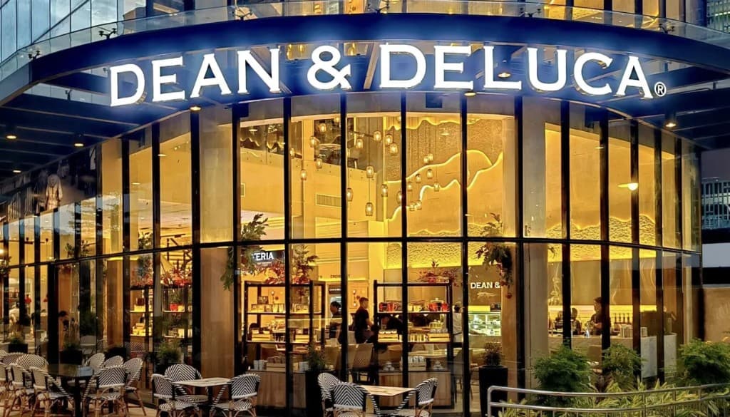Dean & DeLuca cafe and market storefront at night