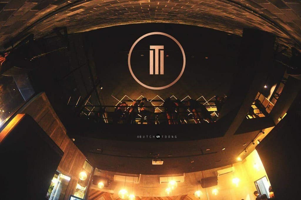 Trademark club interior with mezzanine and logo wall